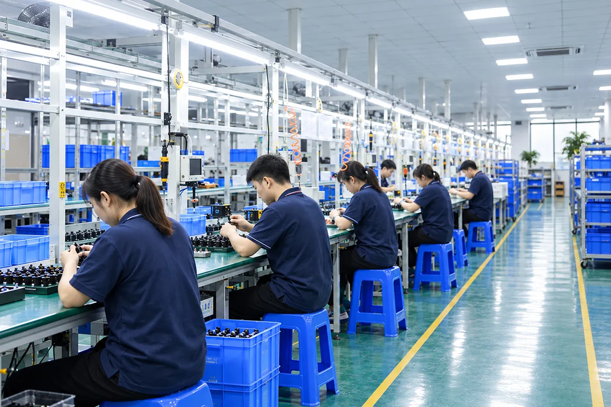 Workers assembling EV chargers on the production line